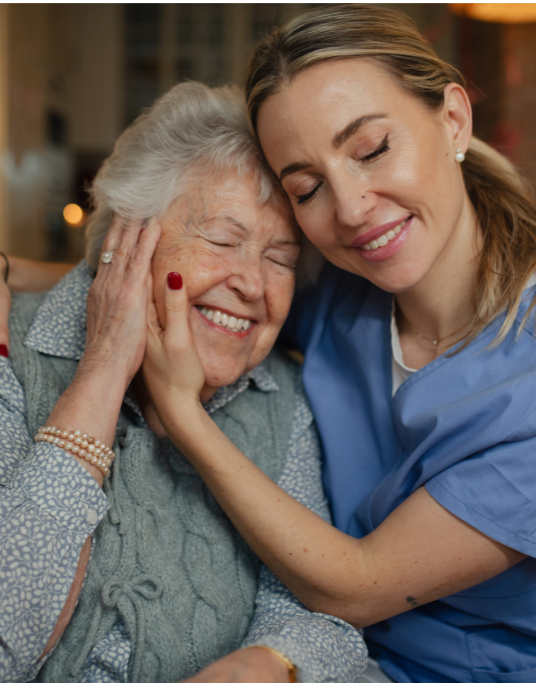 A Premier Home Care caregiver and a senior client sharing coffee at home in Chatsworth, CA